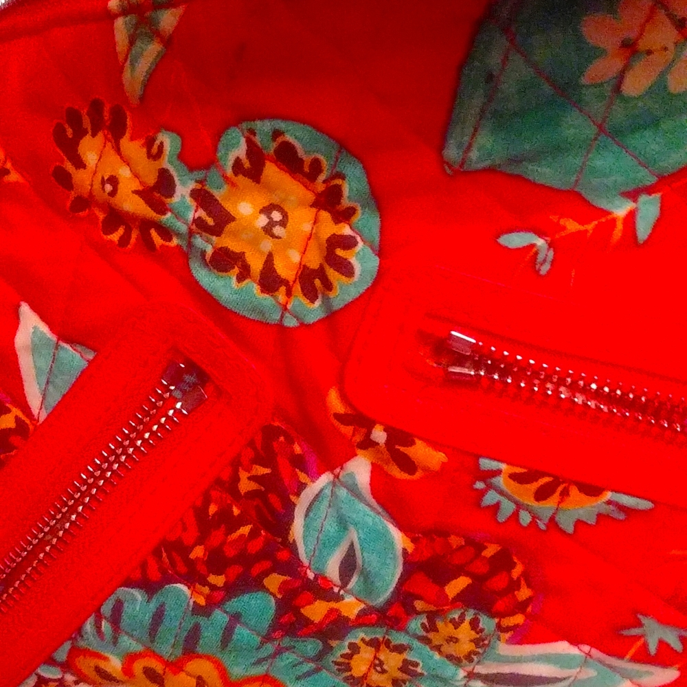 Vera Bradley purse with shoulder straps.